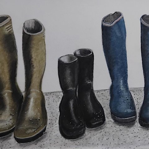 Three pairs of boots side by side blue, black and light brown.